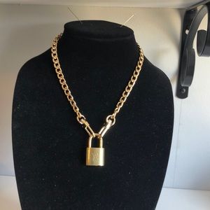 Authentic Louis Vuitton lock. No chain.